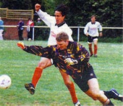 Yorkie Davies challenges Knocholt keeper during Sevenoaks Charity Senior Cup Final