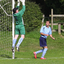 Platt FC - Martin Smith watches as Adam Luscombe holds on to cross