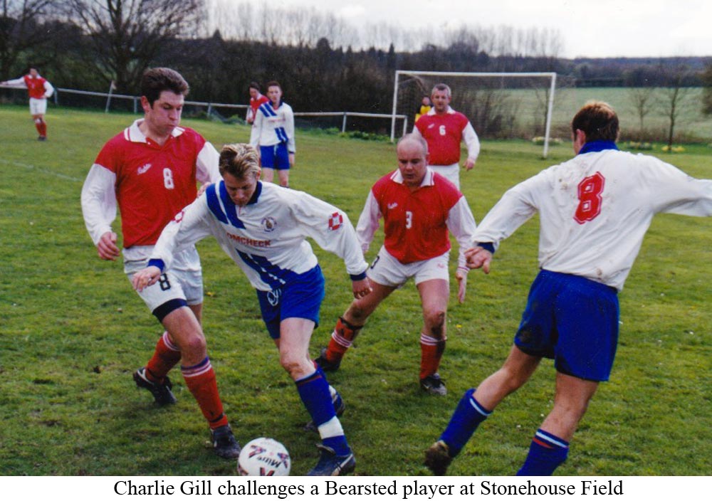 Platt's 'Charlie' Gill challenges Bearsted player in Kent County League action at Stonehouse Field in 1998