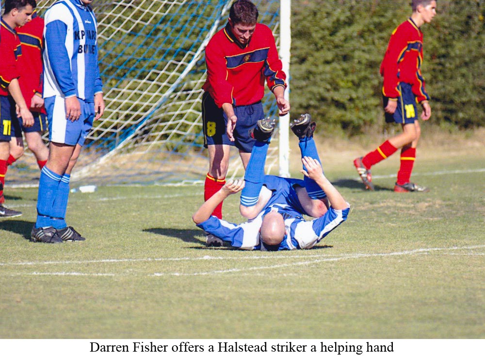 Platt defender Darren Fisher offers a helping hand up to a Halstead striker during a Kent County League game in 2004